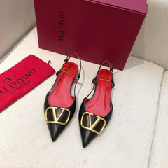 VLOGO SIGNATURE BLACK CALFSKIN FLAT SLINGBACK PUMP WITH GOLD LOGO