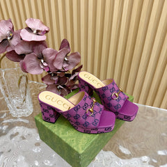 HORSEBIT SLIDE SANDAL IN VIOLET MONOGRAM CANVAS AND SHEEPSKIN LINING