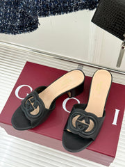 MID-HEEL MULE IN BLACK CALFSKIN