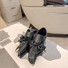 POINTED-TOE FLATS WITH BOW IN BLACK SOFT LAMBSKIN