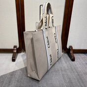 LAGRE WOODY TOTE BAG 45 IN BEIGE LINEN CANVAS BLACK WEBBING LOGO EMBROIDER WHITE CALFSKIN