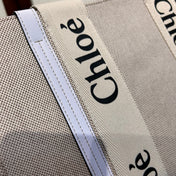 MEDIUM WOODY TOTE BAG 37 IN BEIGE LINEN CANVAS WEBBING BLACK LOGO EMBROIDER WHITE CALFSKIN