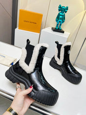 LV RUBY FLAT ANKLE BOOT IN BLACK CALFSKIN AND WHITE SHEARLING