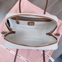 BOWLING BAG 28 IN WHITE CANVAS AND BROWN CALFSKIN TRIM