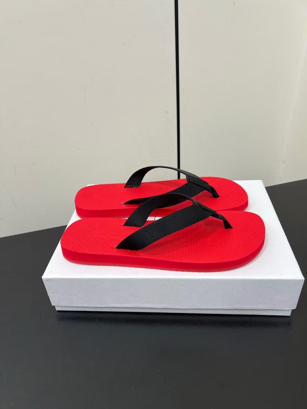 THE ROW THICK-SOLED FLIP FLOPS IN RED RUBBER