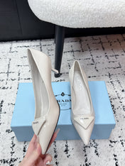 PRADA 26S POINTED-TOE HIGH HEELS 60MM IN CREAM WHITE PATENT CALFSKIN WITH LOGO