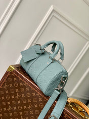 KEEPALL BANDOULIÈRE 25 BAG IN MISTY LAKE GREEN MONOGRAM TAURILLON CALFSKIN