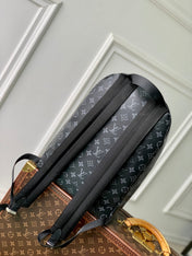 DISCOVERY SLIM BACKPACK 38 IN BLACK MONOGRAM ECLIPSE COATED CALFSKIN