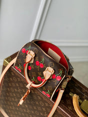 SPEEDY BANDOULIÈRE 20.5 BAG IN BROWN CANVAS CHERRY PRINTED