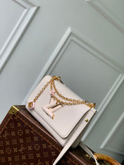 TWIST SLIM 19 IN LIGHT PINK TAURILLON CALFSKIN GOLD HARDWARE