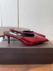 ALAIA 26S HEELED MULES 50 MM IN DARK RED GLOSSY CALFSKIN