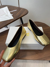 THE ROW 26S FLATS IN GOLD CALFSKIN