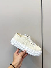 MIUMIU 26S PLATFORM SNEAKERS IN LIGHT YELLOW CANVAS