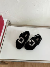 SLIDY VIV' WINTER FUR STRASS BUCKLE SANDALS IN BLACK SHEARLING