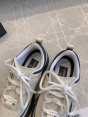CHANEL 25S TRAINERS 40MM IN WHITE AND BLACK CALFSKIN