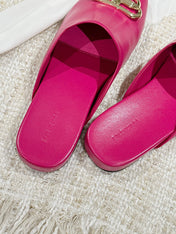 FLAT MULES IN DEEP PINK SMOOTH CALFSKIN GOLD BUCKLE