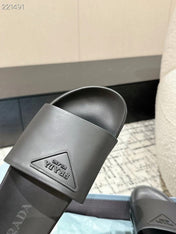 PRADA 25S RUBBER SLIDE IN CHARCOAL CALFSKIN WITH LOGO