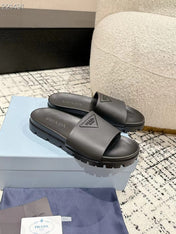 PRADA 25S RUBBER SLIDE IN CHARCOAL CALFSKIN WITH LOGO