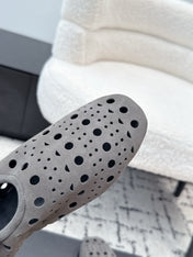 ALAIA 26S FLAT SLIP-ONS IN GREY SUEDE WITH OPENWORK PATTERN