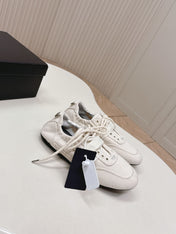 PRADA 26S LACE UP MINIMAL SNEAKERS IN WHITE CANVAS