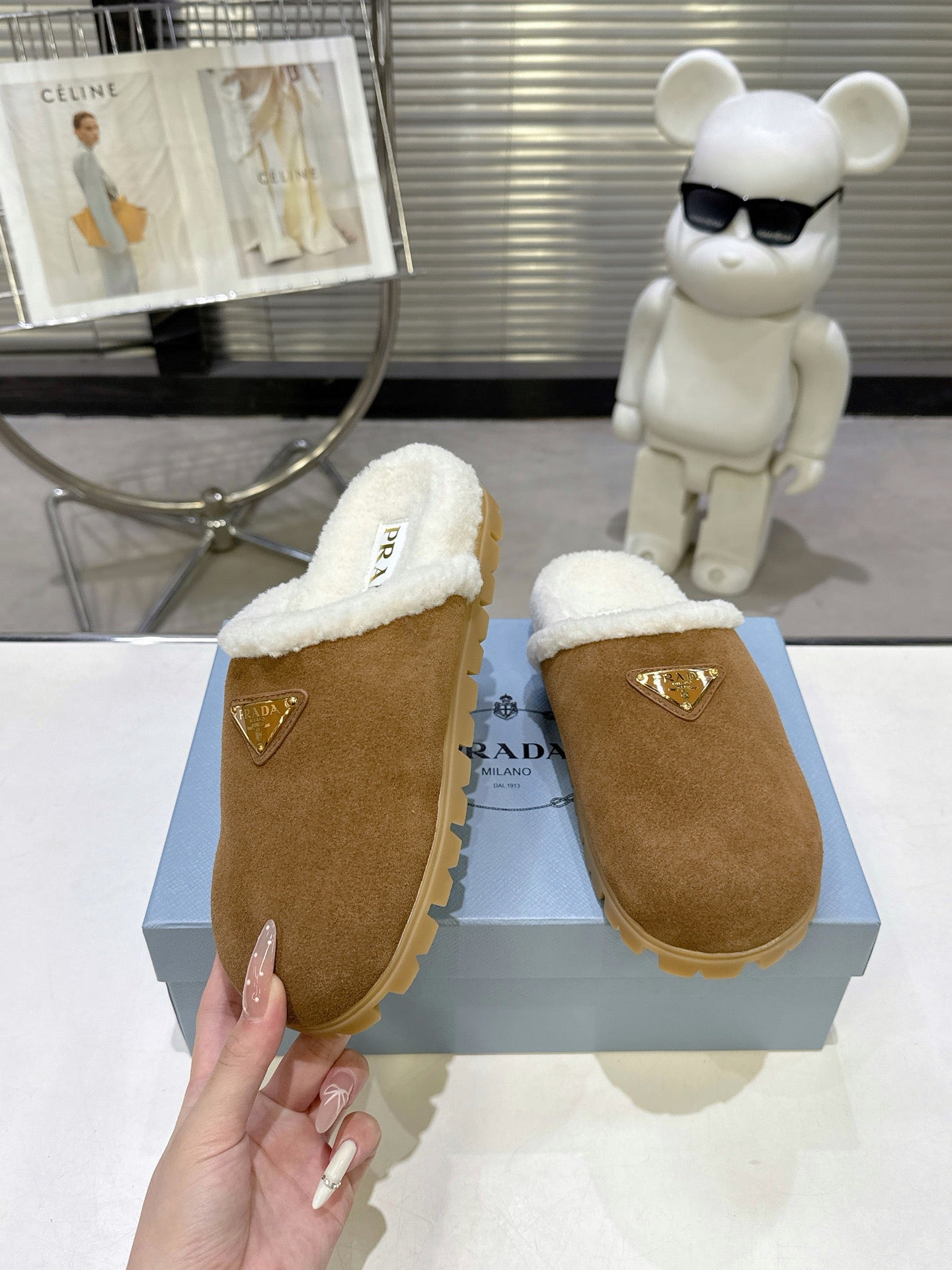 PRADA 25S FUR-LINED MULES IN BROWN SUEDE
