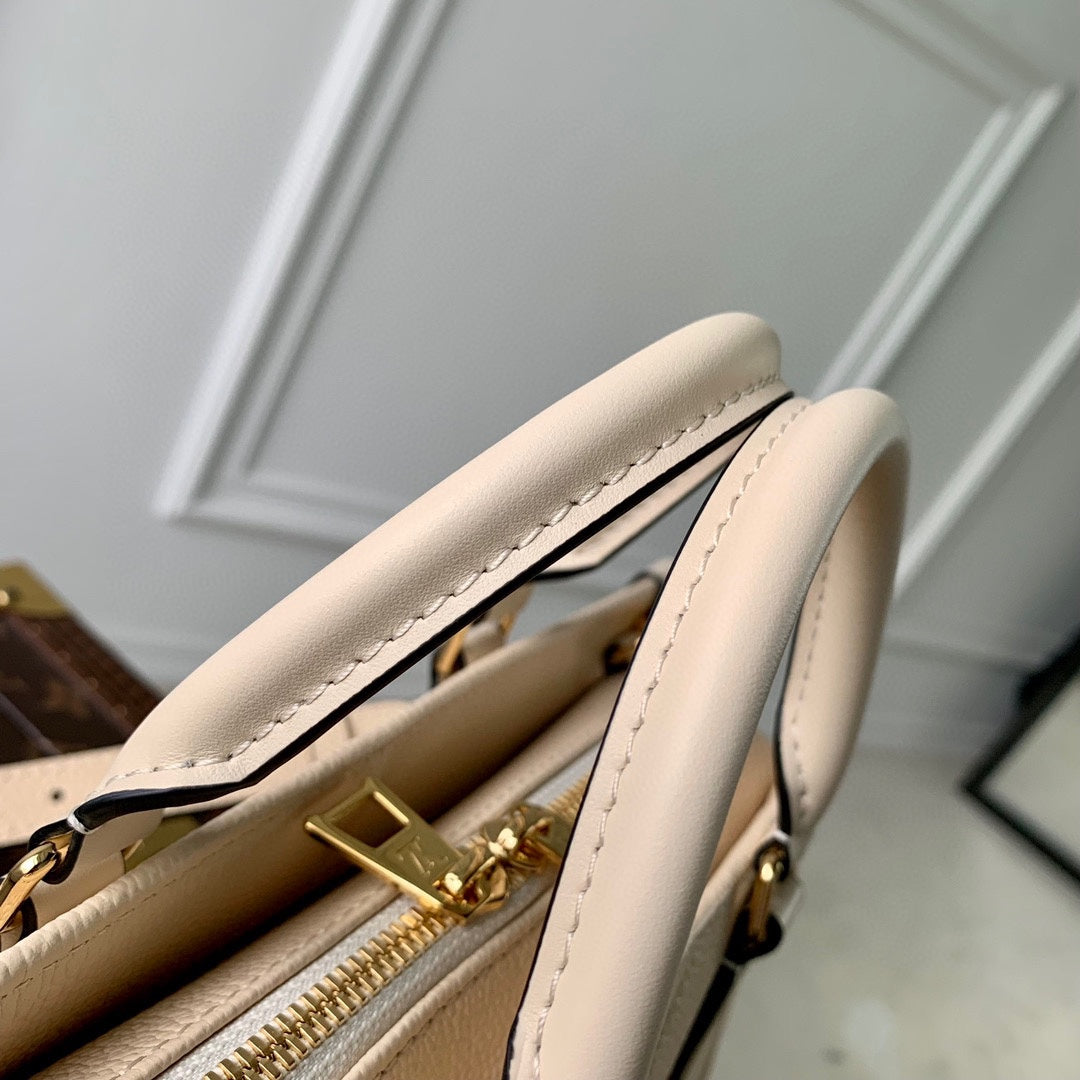 ONTHEGO EAST WEST BAG 25 IN BEIGE MONOGRAM EMBOSSED COWHIDE