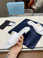 PRA SAFFIANO PATENT SLIDES OSTRICH MOTIF WHITE CALFSKIN