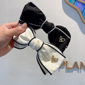 BOW HAIRPIN IN BLACK AND WHITE TRIM COTTON 406022