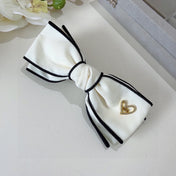 BOW HAIRPIN IN WHITE AND BLACK TRIM COTTON 406023
