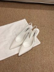 PRADA 26S SLINGBACK PUMPS IN WHITE PATENT CALFSKIN