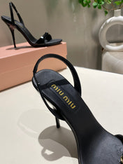 TWO STRAP HIGH HEELED SANDALS IN BLACK GLOSSY SHEEPSKIN