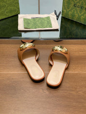 FLAT MULE IN BRONE BROWN CALFSKIN WITH GOLD HARDWARE