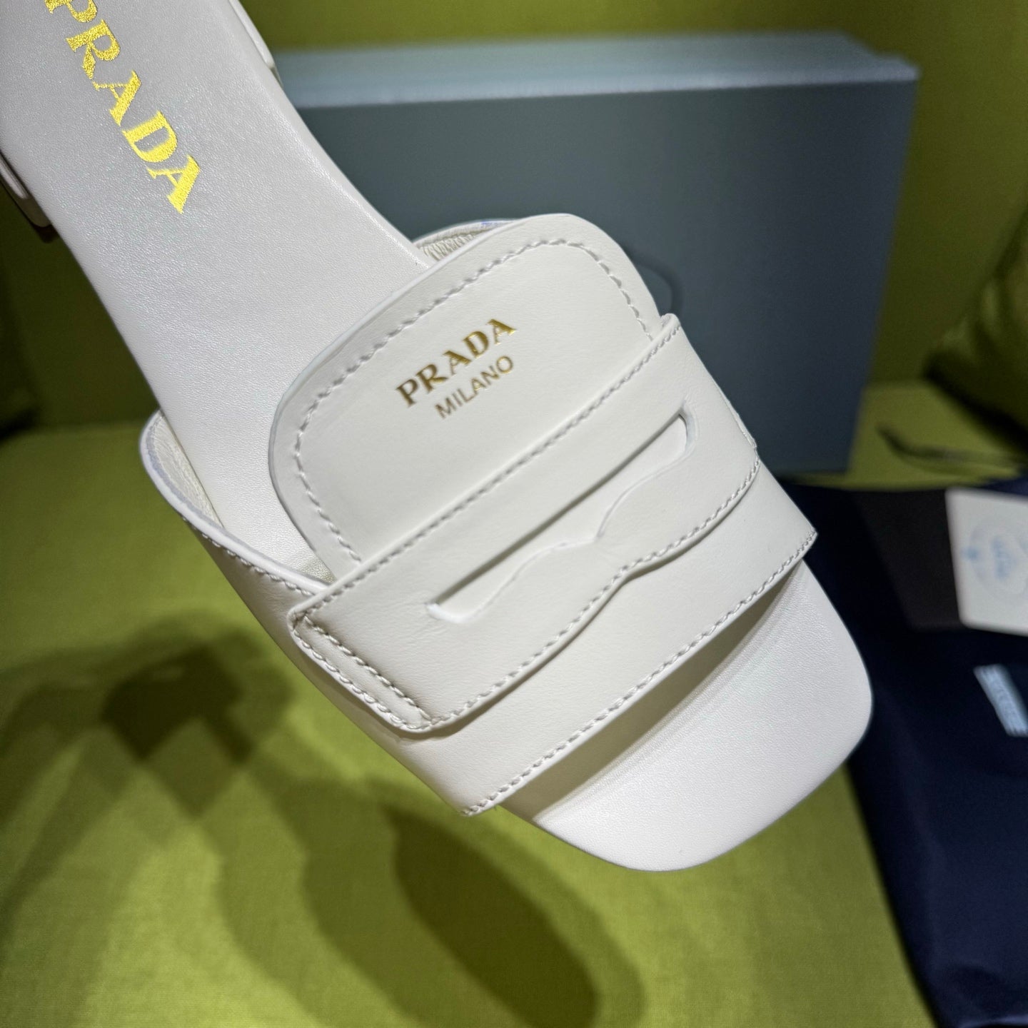 PRADA 25S SLIDES IN WHITE CALFSKIN