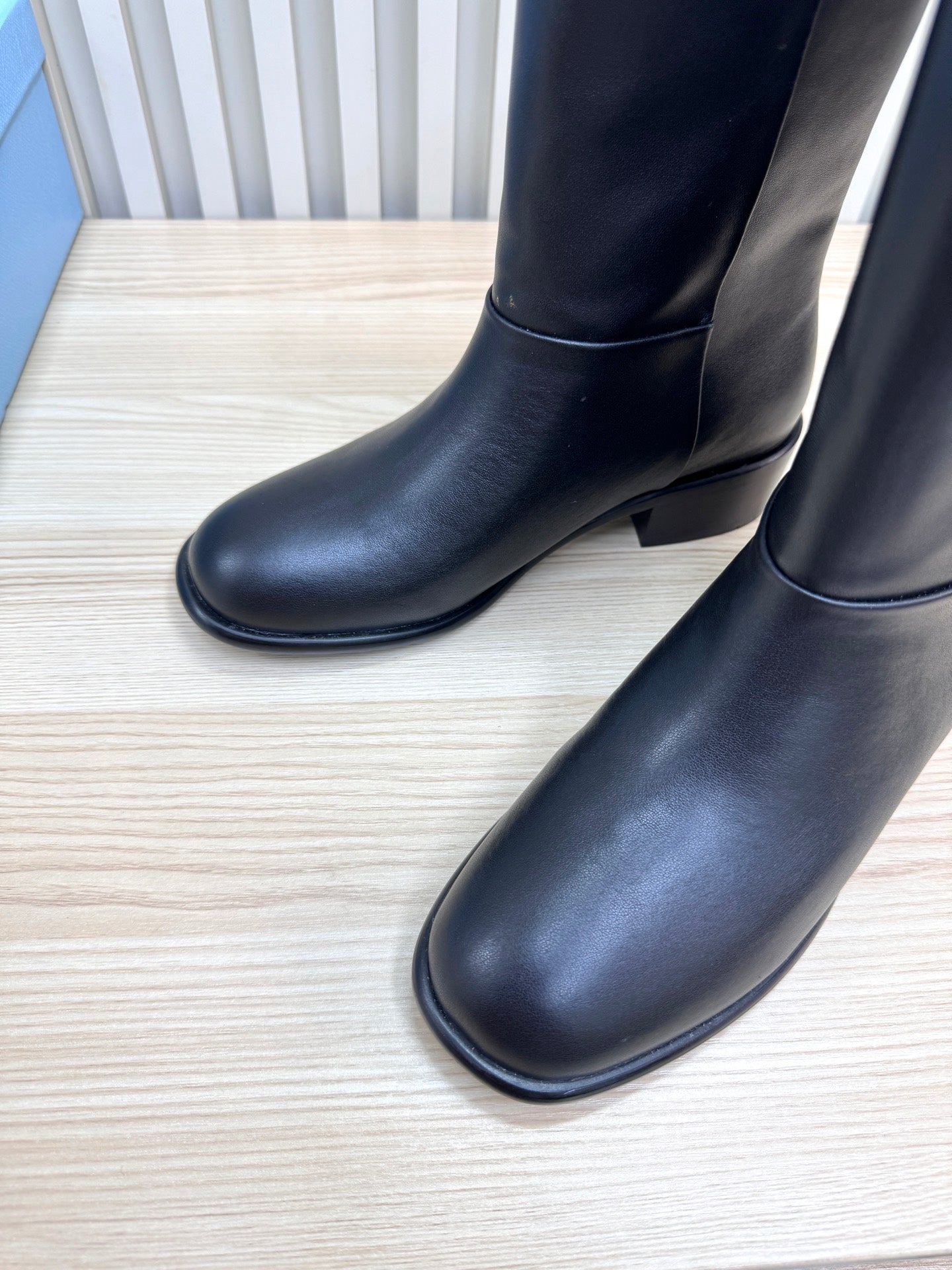 PRADA 25S LOW-CUT BOOTS IN BLACK LAMBSKIN
