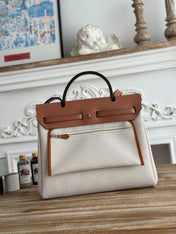 HERBAG ZIP 31 RETOURNE PEGASE POP BAG IN OFF-WHITE MIX RED CANVAS AND HUNTER COWHIDE