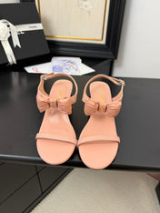 MID HEEL SANDALS IN PEACHY PINK CALFSKIN WITH BOW