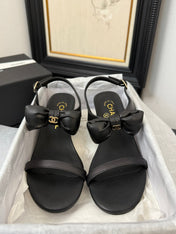 MID HEEL SANDALS IN BLACK CALFSKIN WITH BOW