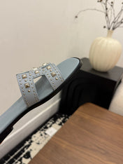 HM 26S ORAN STUDDED SANDALS IN DUSTY BLUE CALFSKIN