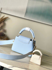 CAPUCINES MINI 21 IN CANDY BLUE TAURILLON GOLD HARDWARE