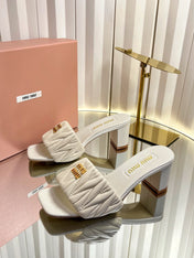 MIUMIU 26S PADDED MATELASSE MULE HEELS 65MM IN LIGHT BEIGE CALFSKIN GOLD HARDWARE
