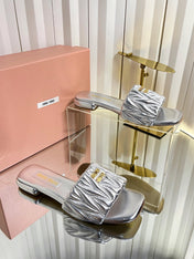 MIUMIU 26S MATELASSE SLIDES IN SILVER CALFSKIN GOLD HARDWARE