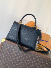 MADELEINE 30 IN BLACK MONOGRAM CALFSKIN EMBOSSED LOGO