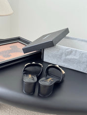 MULE SLIDE SANDALS IN BLACK LAMBSKIN WITH LOGO STICKER DETAIL