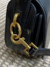 VOLTAIRE HALF-MOON SHOULDER BAG 24 IN BLACK CALFSKIN GOLD METALLIC