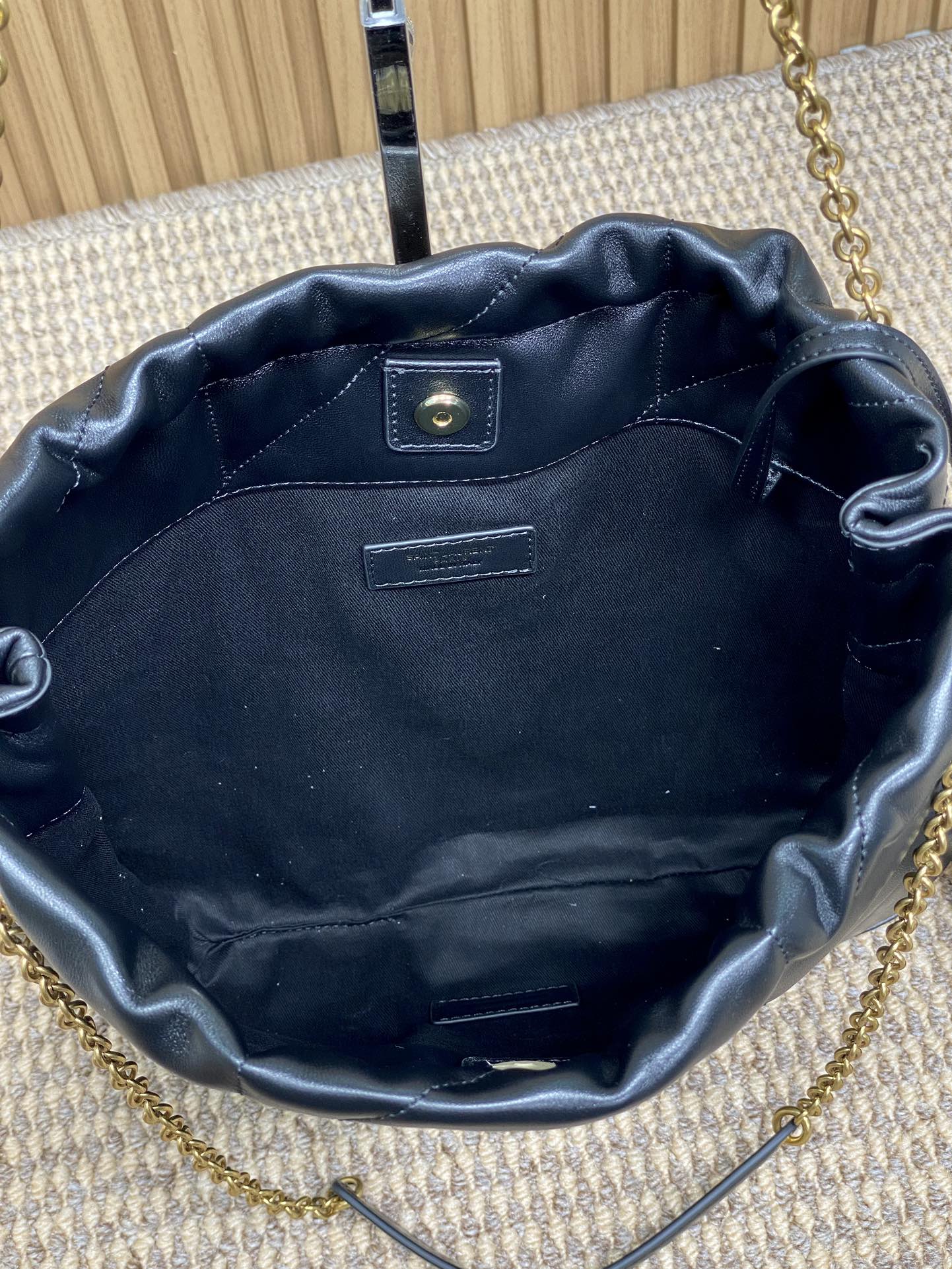 DRAWSTRING CHAIN STRAP SHOULDER BAG 39 IN BLACK QUILTED CALFSKIN
