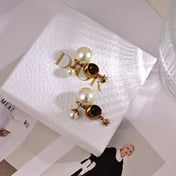 CD 26S CELESTIAL STAR PEARL DROP LOGO EARRINGS IN GOLD TONE METAL 629950