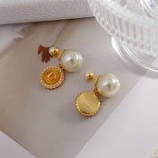 CD 26S DOUBLE PEARL MEDALLION LOGO DROP EARRINGS IN GOLD METAL