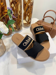 WOODY WEDGE SANDALS IN BLACK CANVAS WITH CIDER BROWN RUBBER SOLE