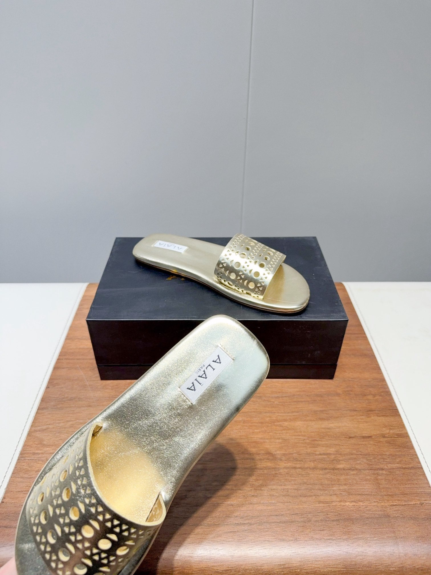 ALAIA FLAT SANDALS WITH PERFORATED STRAPS 25S IN GOLD LAMBSKIN