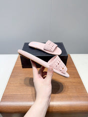 ALAIA FLAT SANDALS WITH PERFORATED STRAPS 25S IN LIGHT PINK SUEDE